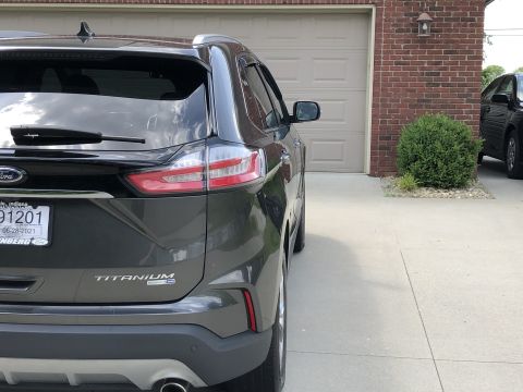 2019 Ford Everest - Rear view of a dark gray SUV, identified as a Titanium model, with a license plate from June 2021.