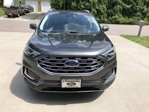 2019 Ford Everest - Dark gray Ford Edge SUV shown from the front, parked on a driveway.