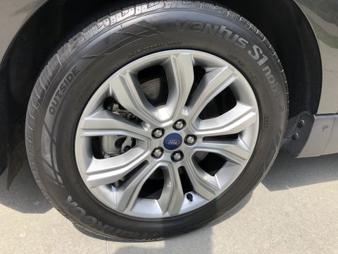 2019 Ford Everest - A close-up view of the front passenger-side wheel and tire of a vehicle. The tire is a Hankook Ventus S1 noble2 with the word "OUTSIDE" vis…
