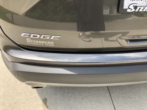 2019 Ford Everest - The rear bumper and tailgate of a dark gray SUV are shown. Visible badging includes "EDGE" and "STERNBERG AUTOMOTIVE GROUP".