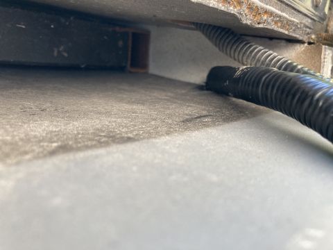 2015 Ford F-550 - Close-up view of a vehicle's underbody, showing a portion of a tire.
