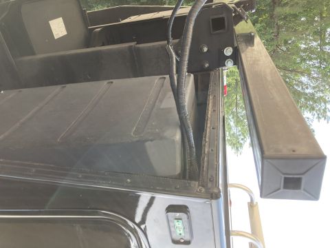 2015 Ford F-550 - Close-up view of the underbody of a truck bed, showing a large fuel tank and electrical wiring.