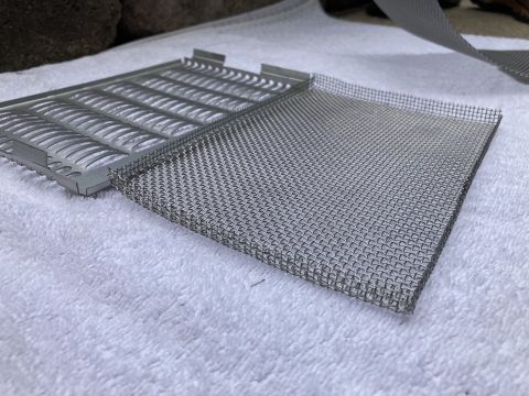 2015 Ford F-550 - Two metal bug screen pieces are shown on a white towel.