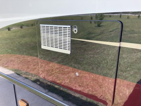 2015 Ford F-550 - Exterior vent labeled 'HOT' on the side of an RV.