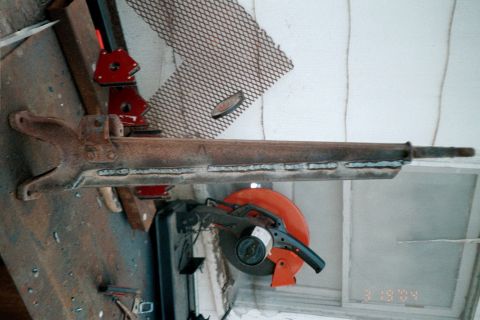 1979 Ford Bronco - A rusty steering linkage component is shown, possibly undergoing repair or modification.