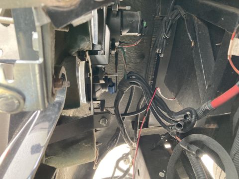 2015 Ford F-550 - A complex wiring harness is visible, attached to a metal bracket on a vehicle.