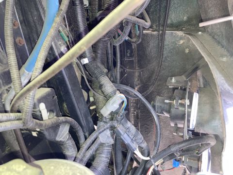 2015 Ford F-550 - Vehicle wiring harness and components, including a horn or speaker, are visible in this close-up view.