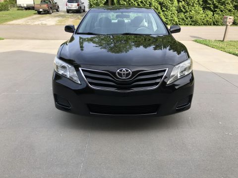2011 Toyota Camry - Front view of a black 2011 Toyota Camry parked on a driveway.