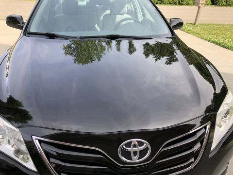 2011 Toyota Camry - The grille design and headlights suggest this Toyota Camry is from the 2007-2009 model years, not 2011.