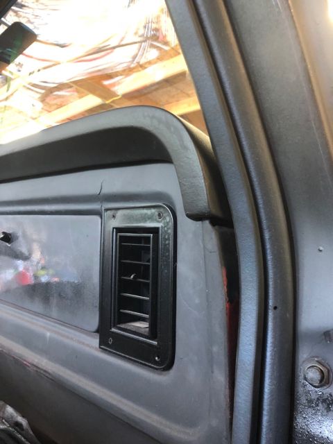1978 Ford Bronco - Close-up of the interior vent and dashboard of a 1978 Ford Bronco.