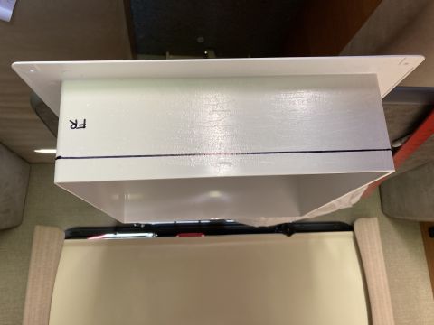 2015 Ford F-550 - A white rectangular duct with black marker lines and the letters "FR" written on the side is installed in what appears to be an interior RV…