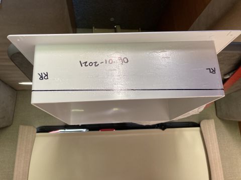 2015 Ford F-550 - A white rectangular duct with black writing on it is shown, with the text "1202-10-30", "RR", and "RL" visible. A black line is drawn acros…