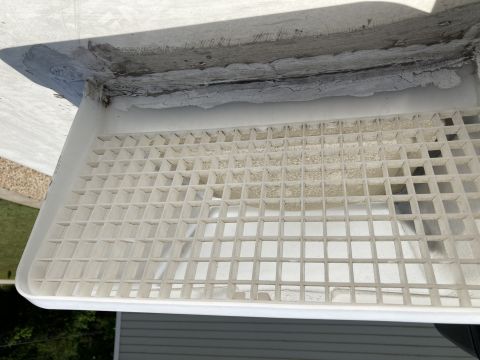 2015 Ford F-550 - A white plastic vent with a grid pattern is shown, attached to a surface that appears to be the exterior of a vehicle. The vent is dusty an…