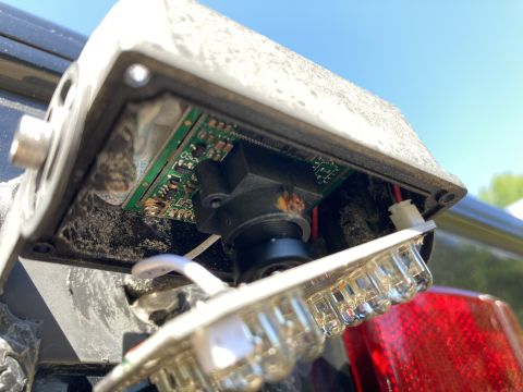 2015 Ford F-550 - Close-up of a vehicle's rear, with the taillight assembly removed to expose wiring.