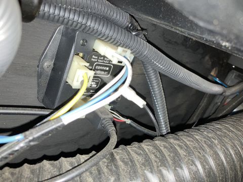 2015 Ford F-550 - A close-up view of a Connex CVS150-01 module with multiple wires connected, mounted in a vehicle's interior.