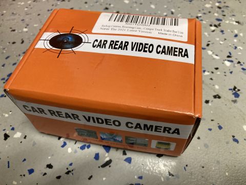 2015 Ford F-550 - The image shows the orange box of a car rear video camera. Text on the box includes "CAR REAR VIDEO CAMERA" and "Made in China".