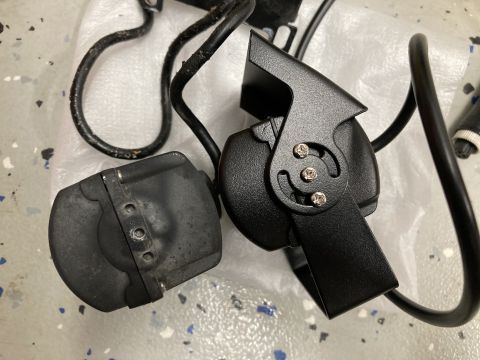 2015 Ford F-550 - Two black electronic components with cables are shown, possibly for a vehicle. One component is a rectangular box with three visible connec…