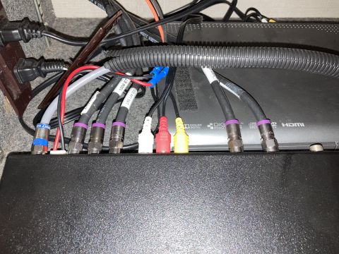 2015 Ford F-550 - A close-up view of various cables and connectors plugged into the back of electronic devices, likely a home entertainment setup.