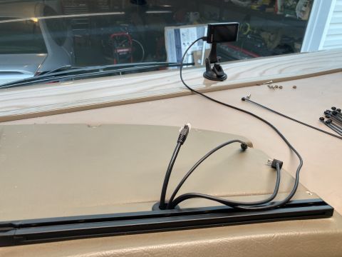 2015 Ford F-550 - Cables and a small screen are installed on the dashboard of a vehicle.