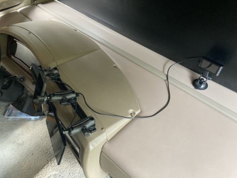 2015 Ford F-550 - A dash-mounted camera and two side mirrors are attached to the interior dashboard of a vehicle. The camera is positioned on the right side…