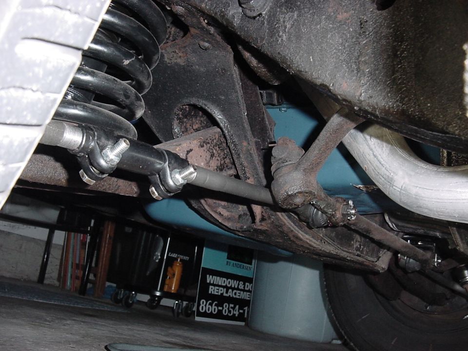 Driver's side view, showing new HD Moog spring.  The whole chassis was painted with red oxide then black.  You can see the red oxide is showing in this shot.