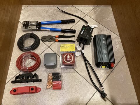 2015 Ford F-550 - Collection of electrical components and tools, including an inverter and battery switch.