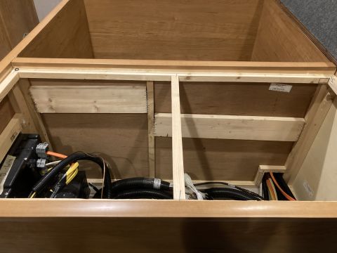 2015 Ford F-550 - This photo shows the internal wiring and components within an RV's storage compartment, not a 2015 Ford F-550.