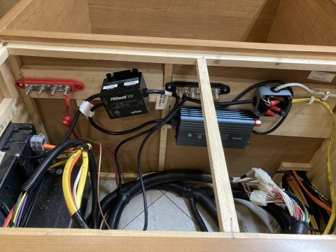 2015 Ford F-550 - This image shows the electrical system of an RV, including a Xantrex PROWATT SW inverter, a battery bank, and various wiring and connection…