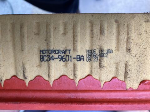 2015 Ford F-550 - A close-up view of a Motorcraft air filter with the part number BC34-9601-BA and manufacturing information printed on it. The filter has a…
