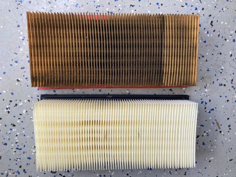 2015 Ford F-550 - A dirty, used air filter is shown above a clean, new air filter. Both filters are rectangular with pleated paper elements and appear to be…