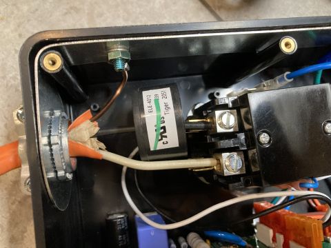 2015 Ford F-550 - Close-up view of the internal wiring and components within an electrical surge protector unit.