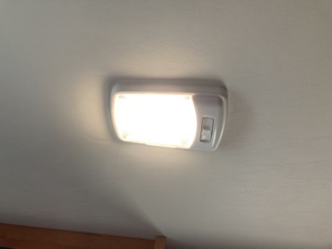 2015 Ford F-550 - A close-up view of a vehicle's interior dome light and its switch.