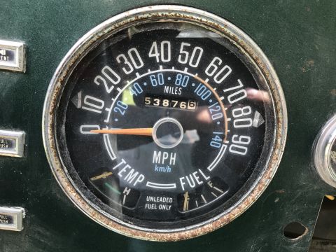 1979 Jeep CJ5 - Close-up of a Jeep CJ5's interior gauge cluster, displaying mileage and fuel level.