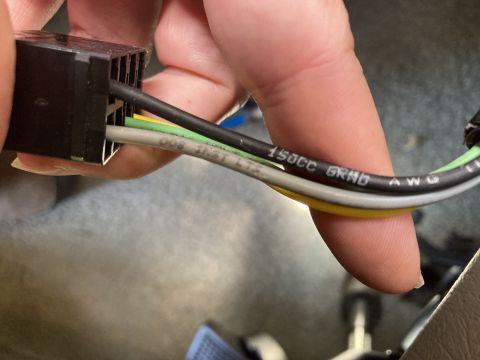 2015 Ford F-550 - Electrical connector with wires, some marked with text like '150CC GRND AWG'.