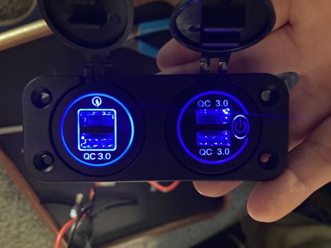 2015 Ford F-550 - This dual USB charger features QC 3.0 technology and illuminated displays, likely installed in a vehicle's interior.
