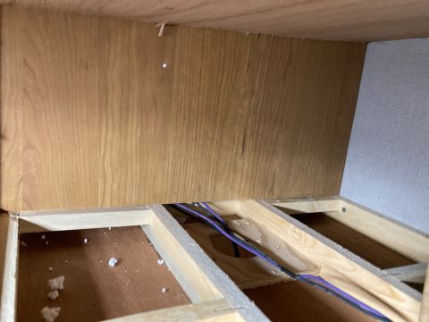 2015 Ford F-550 - The image shows the interior framing and wiring of a structure, not a vehicle.