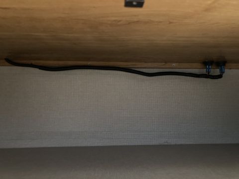 2015 Ford F-550 - Electrical wiring and connectors are visible beneath a cabinet structure.
