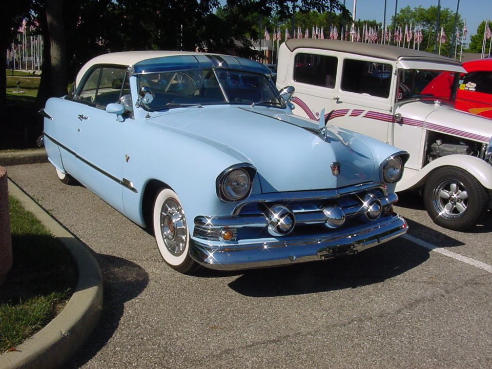 Hey what's with the center bullet on this '52 Ford shoebox?? Or the '57 Chevy headlights??  Or the Cadillac wheel covers?? Or the Packard hood ornament??