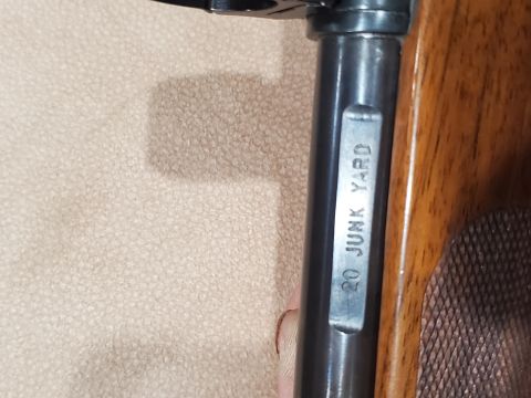 1996 Ford Bronco - A firearm barrel is stamped with "20 JUNK YARD" and shows wood grain details.