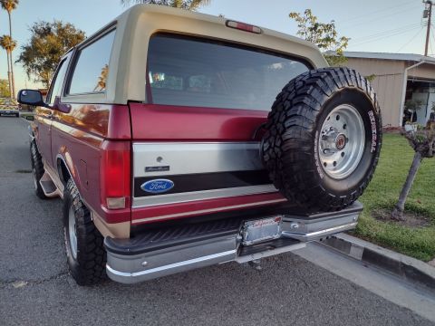 1994 Ford Bronco - This Ford Bronco has a spare tire mounted on the rear bumper.