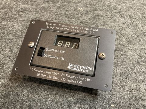 2015 Ford F-550 - Progressive Industries EMS-HW30C surge protector panel shows error codes and operating status.
