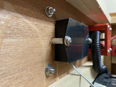 2015 Ford F-550 - Close-up of an electrical component installation on a wooden panel, with a Supermotors logo in the corner.