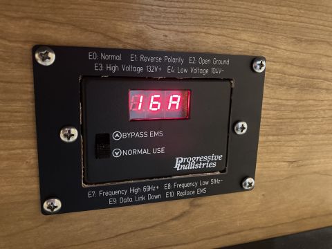 2015 Ford F-550 - Close-up of a Progressive Industries EMS-HW30C surge protector display showing 16A.