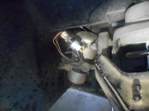 1992 Ford Bronco - A close-up view of automotive sensor and suspension parts, with a SuperMotors logo in the corner.
