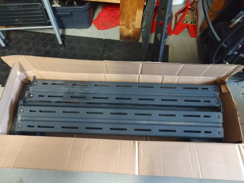 2018 Toyota 4Runner - Roof rack crossbars are shown packed inside a cardboard box.