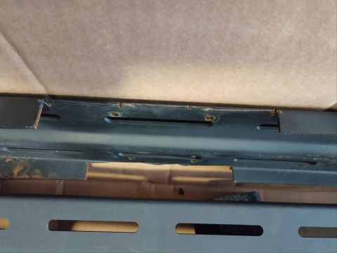 2018 Toyota 4Runner - Detail of a roof rack part, showing mounting slots and some surface wear.