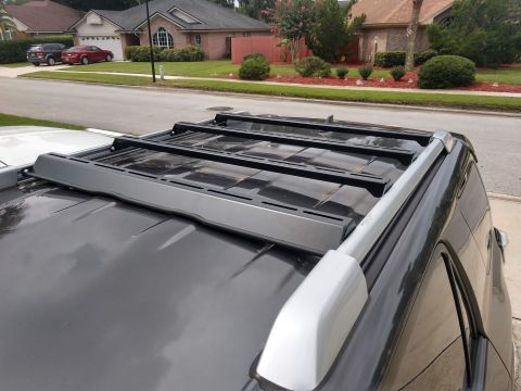 2018 Toyota 4Runner - Close-up of a roof rack system installed on a vehicle's roof.