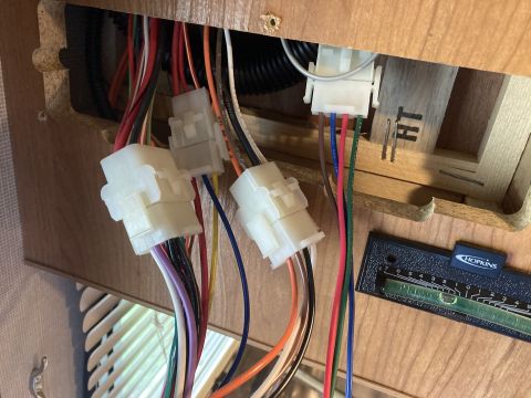 2015 Ford F-550 - A complex electrical wiring harness with various colored wires and connectors is visible.