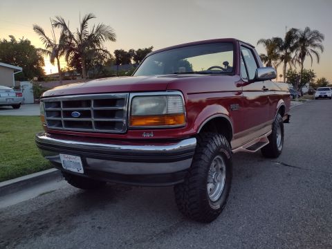 1994 Ford Bronco - This 1994 Ford Bronco 4x4 is shown in a three-quarter front view during sunset.