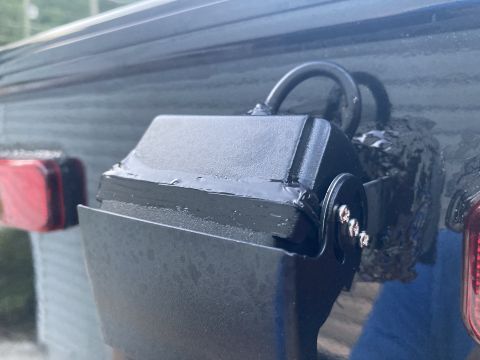 2015 Ford F-550 - A close-up view of a rear-view camera assembly, showing its mounting and wiring details.
